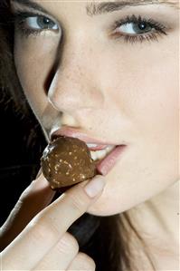 woman eating chocolate