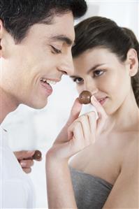 couple eating chocolates