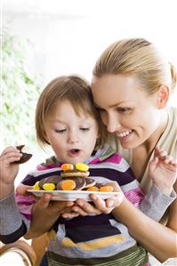 small girl eating sweets