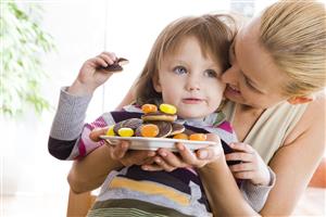 small girl eating sweets