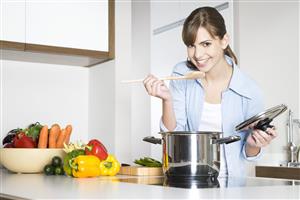 woman tasting soup