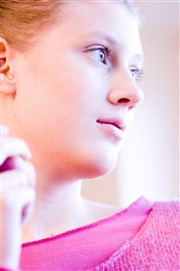 young woman holding red apple