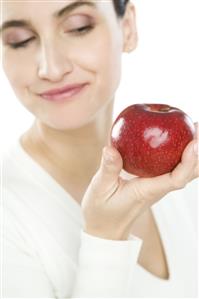 woman holding apple