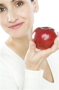 woman holding apple