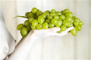 Woman holding grapes