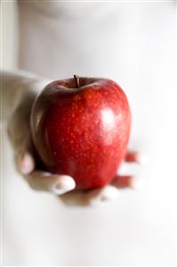 Woman holding apple