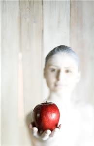 Woman holding apple