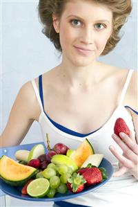 young woman with fruits