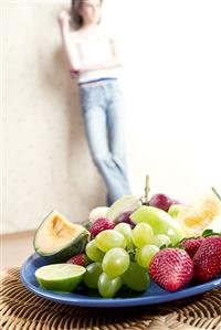 young woman with fruits