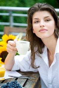 Woman drinking tea on the terrace