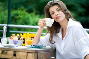 Woman drinking tea on the terrace