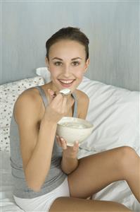 young woman eating muesli