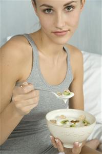 young woman eating muesli