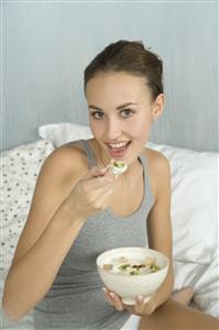 young woman eating muesli