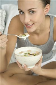 young woman eating muesli