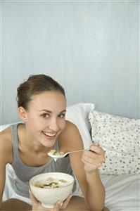 young woman eating muesli