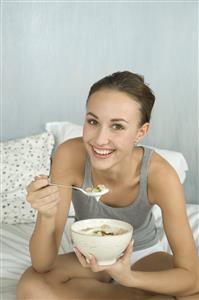 young woman eating muesli