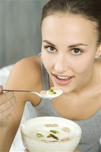 young woman eating muesli