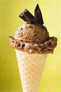 Chocolate ice cream with pieces of chocolate in cone