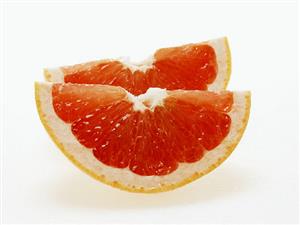 Two wedges of pink grapefruit