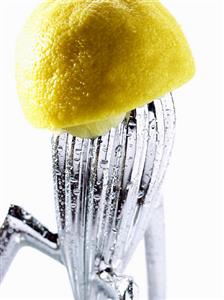 Squeezed lemon on lemon squeezer