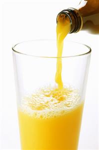 Pouring orange juice