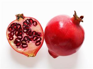 Whole and half pomegranate