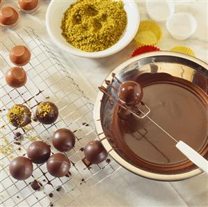 Home-made chocolates with chopped pistachios