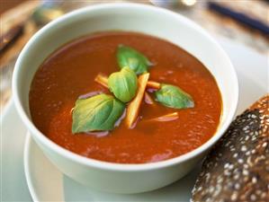 Creamed tomato soup with carrots and basil