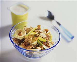 Muesli with apple, banana, almonds and yoghurt