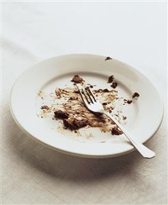 Plate with remains of chocolate mousse