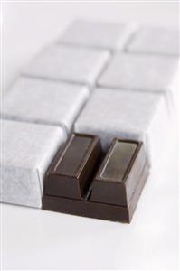 Squares of chocolate with and without wrappers