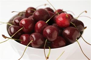 Cherries in a small white bowl