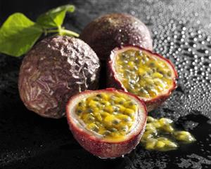 One half and two whole passion fruits