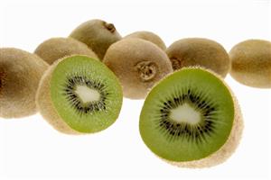 Kiwi fruits, one halved