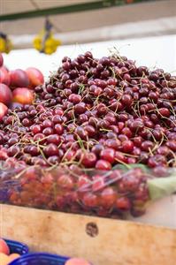 Cherries in a crate at a market