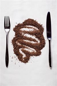 Grated chocolate between knife and fork