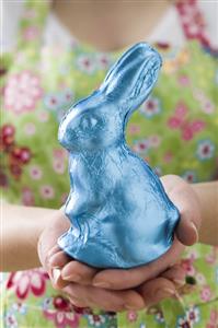 Woman holding Easter Bunny in blue foil