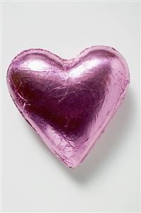 Chocolate heart in pink foil