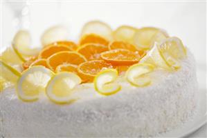 Orange and lemon gateau with grated coconut