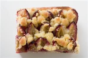 Piece of plum cake (overhead view)