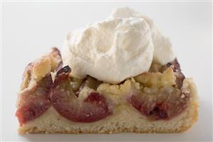 Piece of plum cake with cream