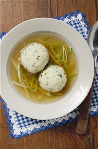 Clear broth with vegetables and dumplings