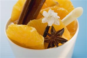 Orange slices with star anise, lemon grass & sugared flower