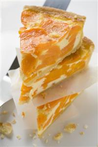 Three pieces of apricot cheesecake