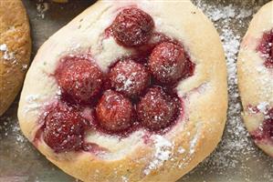 Focaccia with cherries (overhead view)