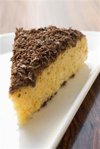 Piece of almond ricotta cake with dark chocolate