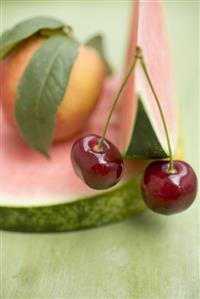 Nectarine with leaves, watermelon and cherries