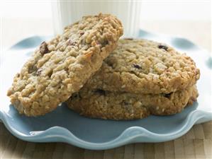 Chocolate chip cookies in front of glass of milk