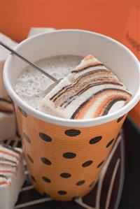 Cocoa with marshmallows in paper cup for Halloween